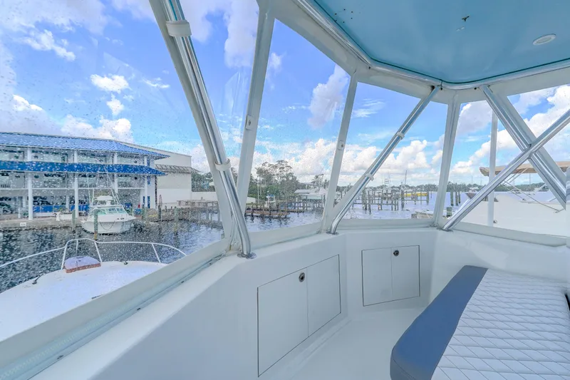 Julia G Yacht Photos Pics 1982 Hatteras 46 Convertible yacht interior with marina view.