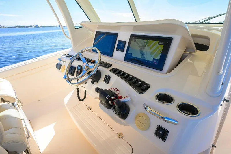  Yacht Photos Pics 2018 Grady-White Canyon 376 helm with advanced navigation displays and controls.