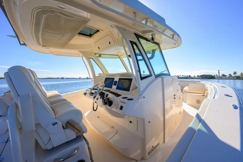  Yacht Photos Pics 2018 Grady-White Canyon 376 boat interior with helm, seats, and ocean view.
