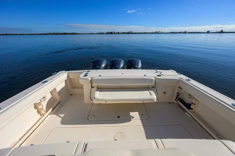  Yacht Photos Pics 2018 Grady-White Canyon 376 boat with triple engines on calm water.