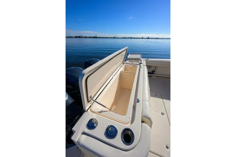  Yacht Photos Pics 2018 Grady-White Canyon 376 boat with open storage compartment, ocean view.