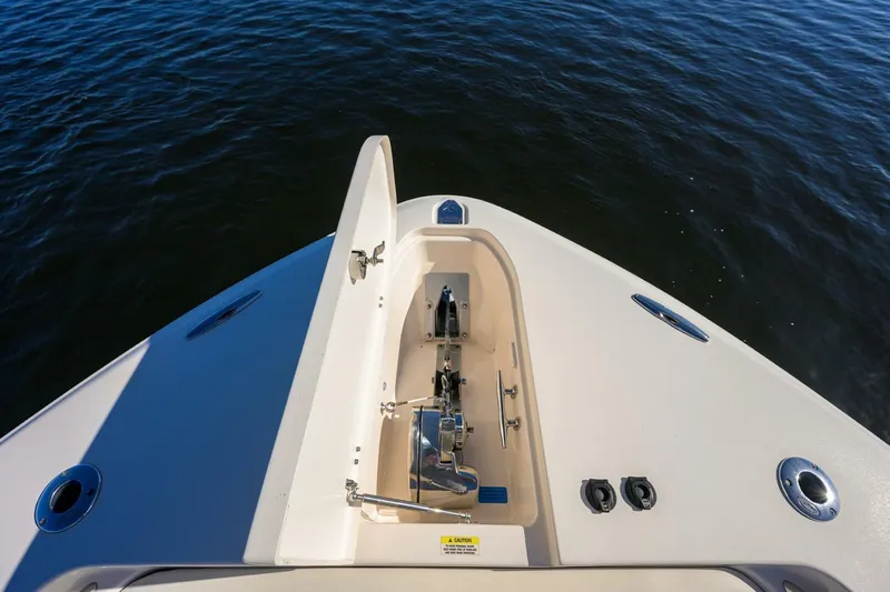  Yacht Photos Pics 2018 Grady-White Canyon 376 boat bow with anchor compartment, on calm water.