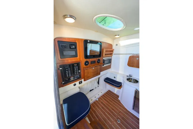  Yacht Photos Pics 2018 Grady-White Canyon 376 cabin interior with wood accents and modern amenities.