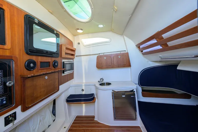  Yacht Photos Pics 2018 Grady-White Canyon 376 cabin interior with wood accents and modern amenities.