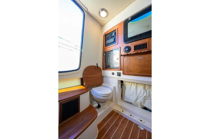  Yacht Photos Pics 2018 Grady-White Canyon 376 boat interior with wooden accents and modern amenities.