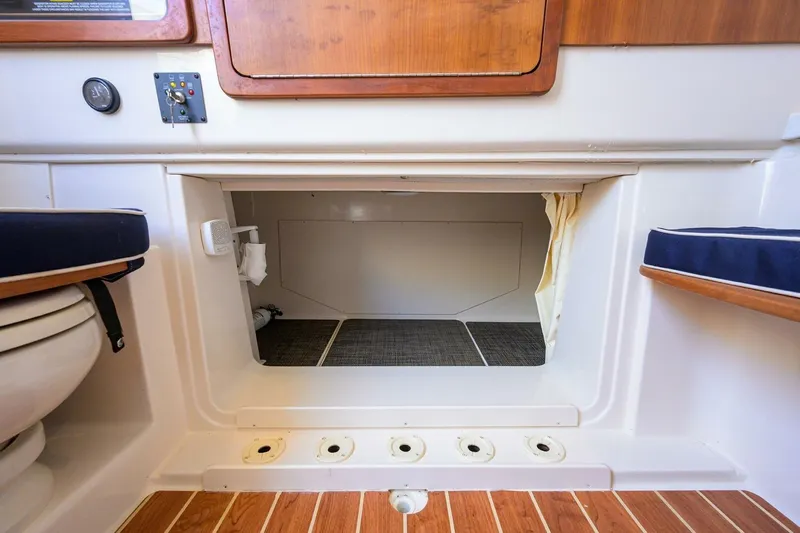  Yacht Photos Pics 2018 Grady-White Canyon 376 cabin interior with storage space and seating.