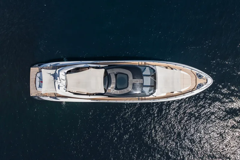  Yacht Photos Pics Aerial view of 2023 Mangusta 104 REV luxury yacht on the water.