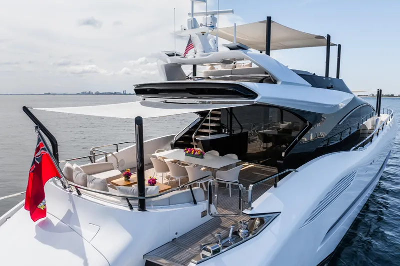  Yacht Photos Pics Luxury 2023 Mangusta 104 REV yacht with elegant deck and seating area.