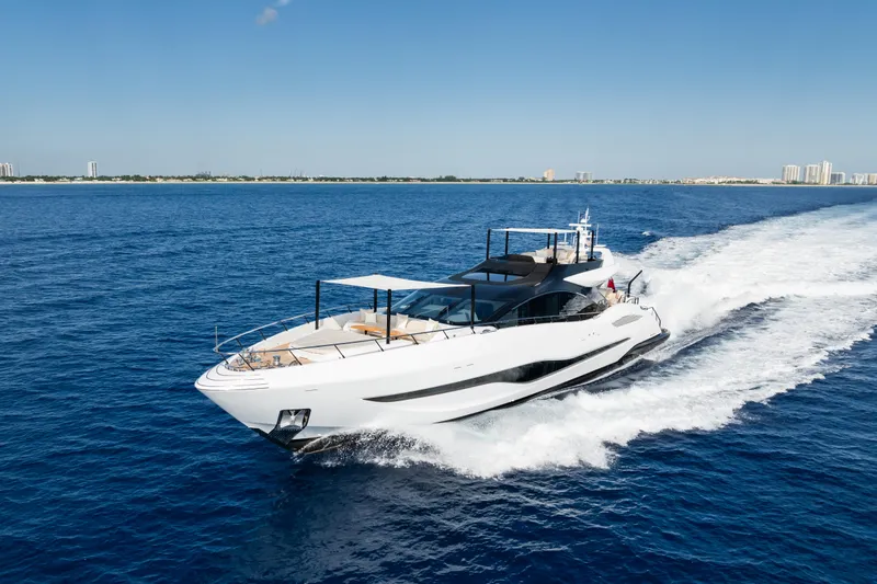  Yacht Photos Pics 2023 Mangusta 104 REV yacht cruising on open blue sea.