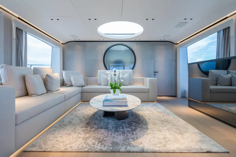 Yacht Photos Pics Luxurious interior of 2023 Mangusta 104 REV yacht with elegant seating and decor.