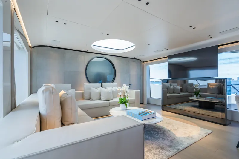  Yacht Photos Pics Luxurious interior of 2023 Mangusta 104 REV yacht with modern furnishings and elegant decor.