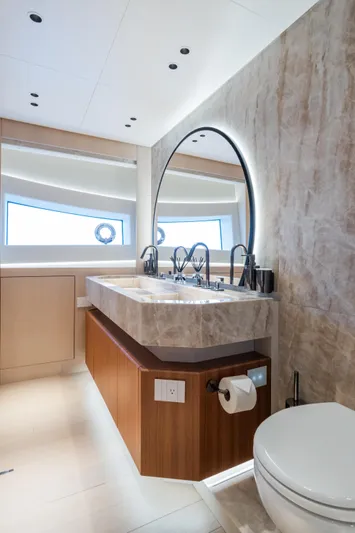  Yacht Photos Pics Luxurious bathroom in 2023 Mangusta 104 REV yacht with modern fixtures and elegant design.