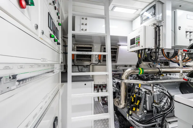  Yacht Photos Pics Engine room of 2023 Mangusta 104 REV yacht, featuring advanced machinery and control panels.
