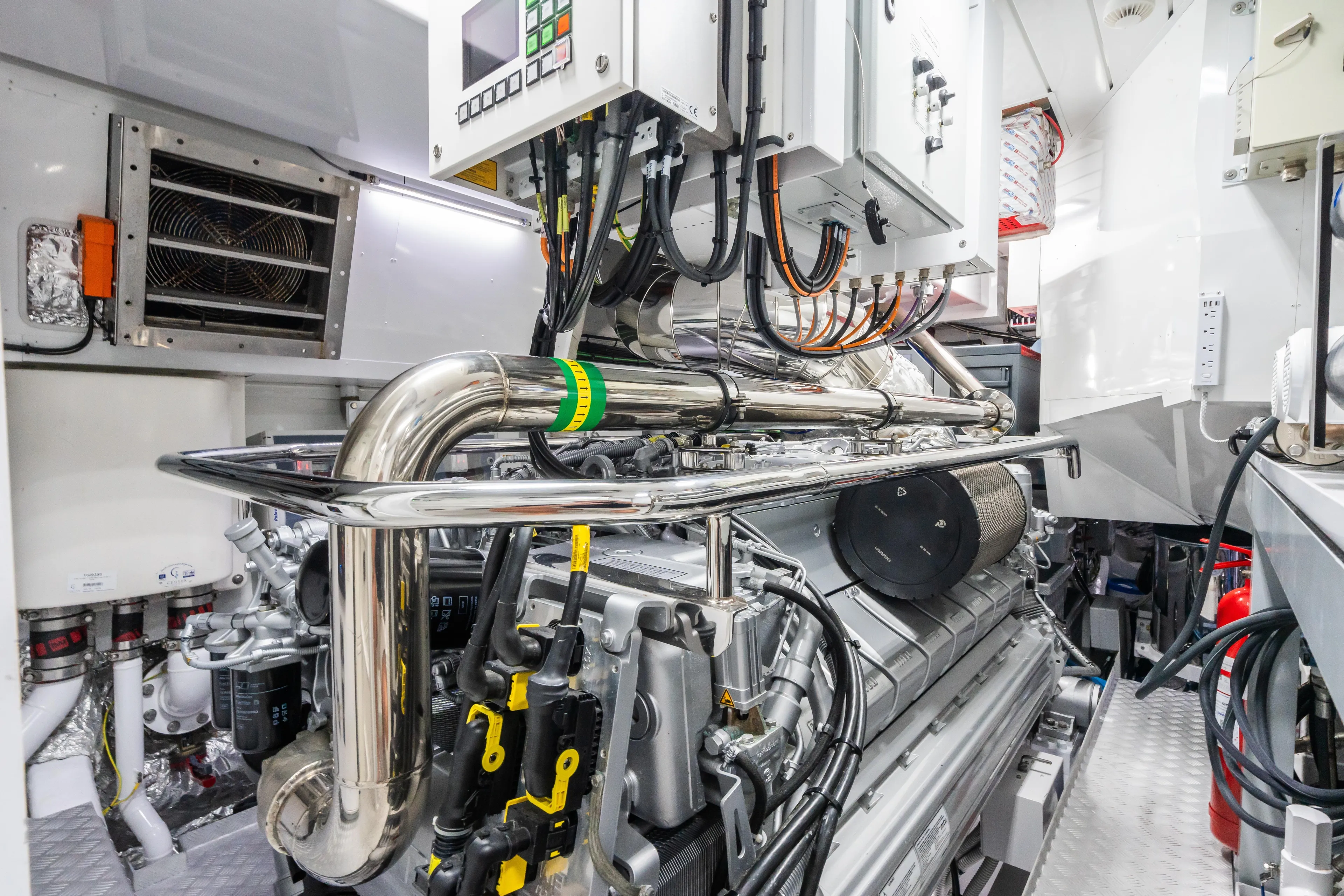 Yacht Photos Pics Engine room of 2023 Mangusta 104 REV yacht, showcasing advanced machinery and piping.