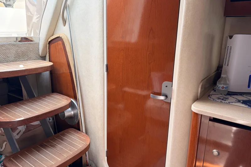  Yacht Photos Pics Interior of 2008 Sea Ray Sundancer 350 with wooden stairs and door.