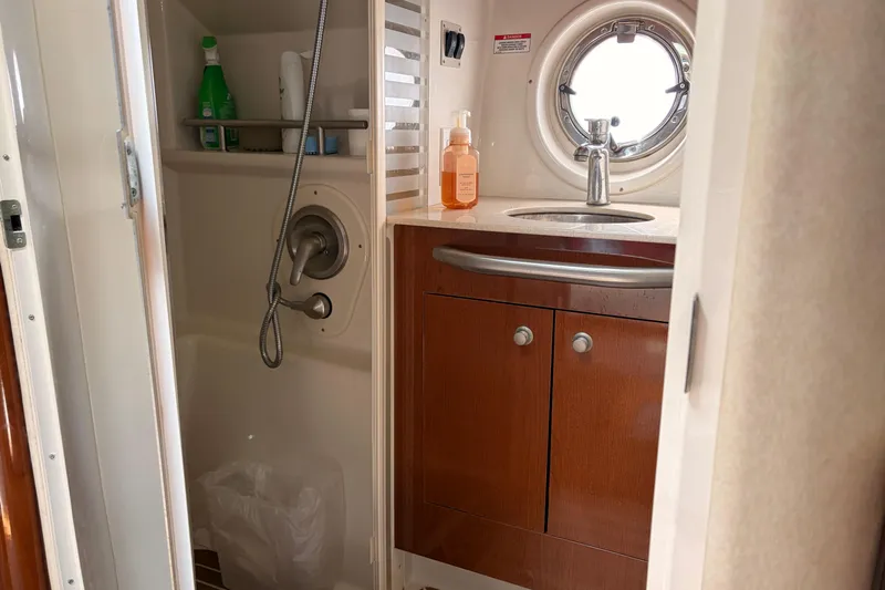  Yacht Photos Pics Bathroom interior of 2008 Sea Ray Sundancer 350 yacht with sink and shower.