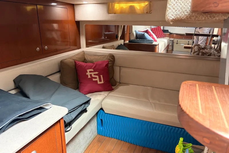  Yacht Photos Pics Interior of 2008 Sea Ray Sundancer 350 with beige seating and decorative pillows.
