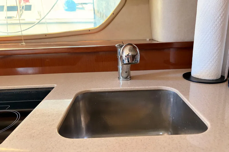  Yacht Photos Pics Kitchen sink area in 2008 Sea Ray Sundancer 350 yacht, featuring modern faucet and countertop.