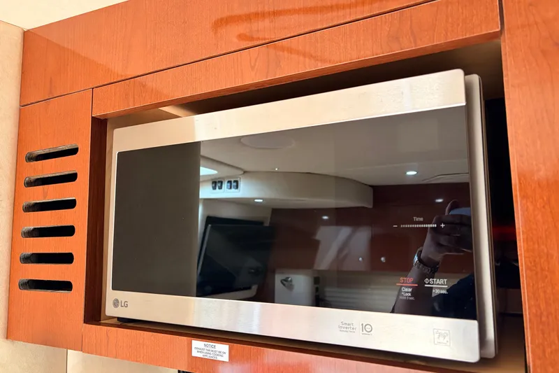  Yacht Photos Pics LG microwave in 2008 Sea Ray Sundancer 350 yacht kitchen, wooden cabinetry.