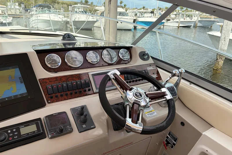  Yacht Photos Pics Cockpit of 2008 Sea Ray Sundancer 350 with steering wheel and navigation instruments.