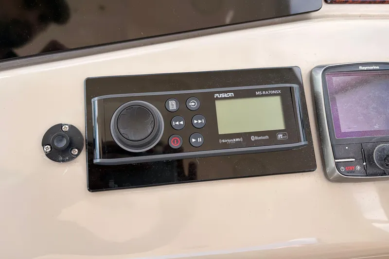  Yacht Photos Pics Control panel of a 2008 Sea Ray Sundancer 350 with Fusion and Raymarine systems.