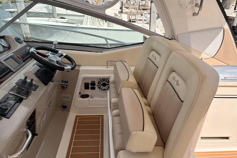  Yacht Photos Pics 2008 Sea Ray Sundancer 350 helm with beige seating and modern controls.