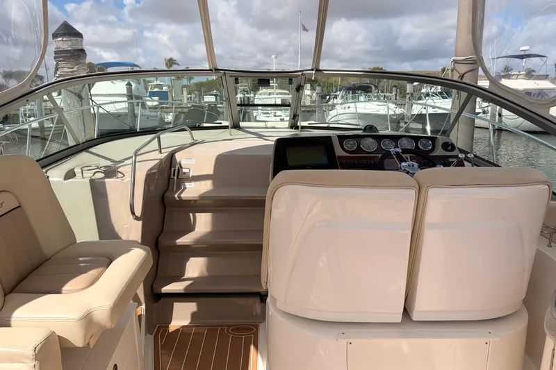  Yacht Photos Pics 2008 Sea Ray Sundancer 350 cockpit with helm, seating, and marina view.
