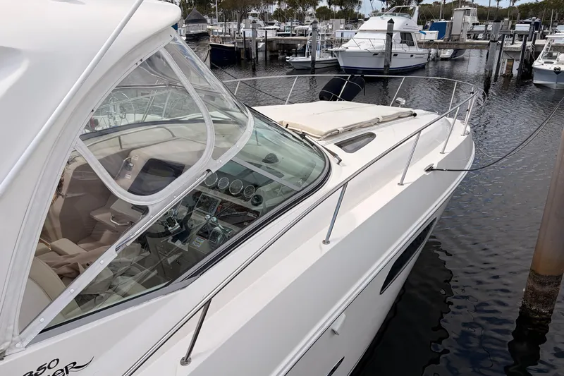  Yacht Photos Pics 2008 Sea Ray Sundancer 350 yacht docked at marina, showcasing sleek design and cockpit.