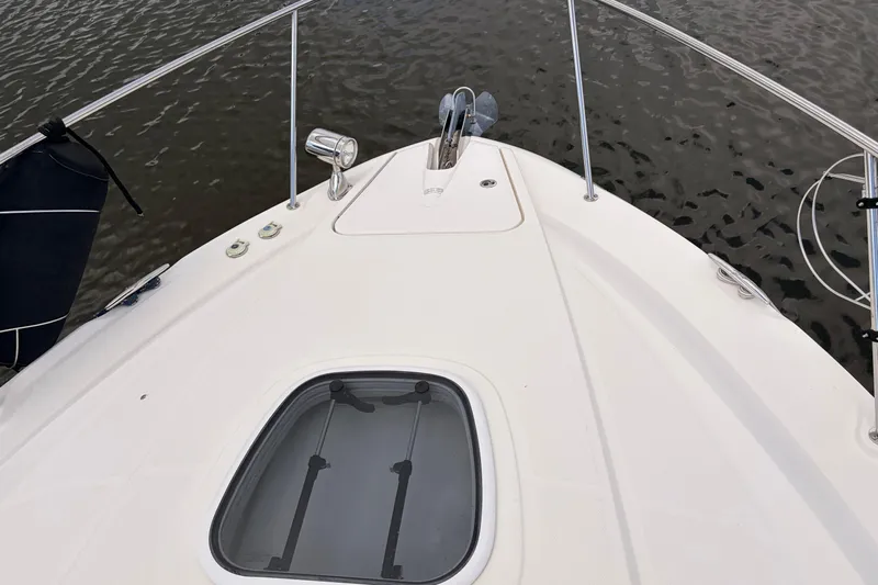  Yacht Photos Pics Bow view of 2008 Sea Ray Sundancer 350 on calm water.