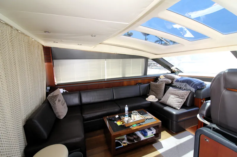  Yacht Photos Pics Luxurious interior of 2013 Princess V62 yacht with leather seating and skylights.