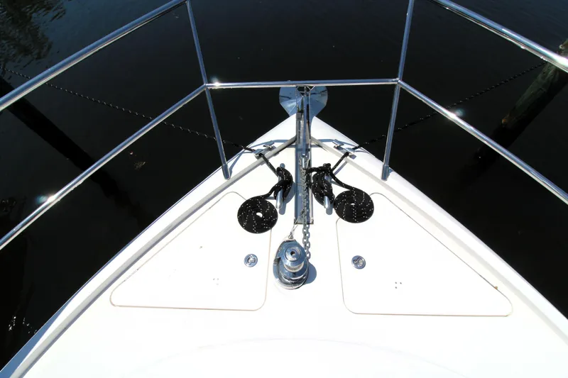  Yacht Photos Pics Bow of 2013 Princess V62 yacht with anchor and railing, viewed from above.