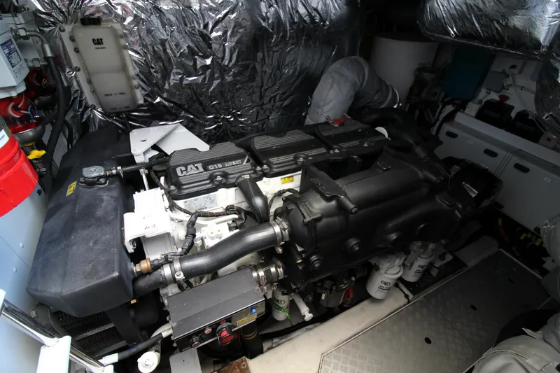  Yacht Photos Pics Engine room of a 2013 Princess V62 yacht, featuring a CAT engine.