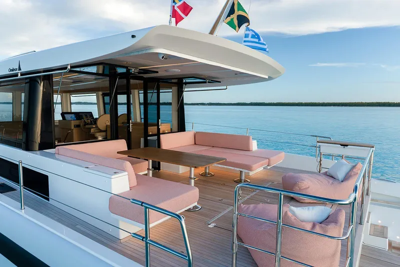  Yacht Photos Pics Luxurious 2026 Omikron Yachts OT-60 with spacious deck and elegant seating on calm waters.