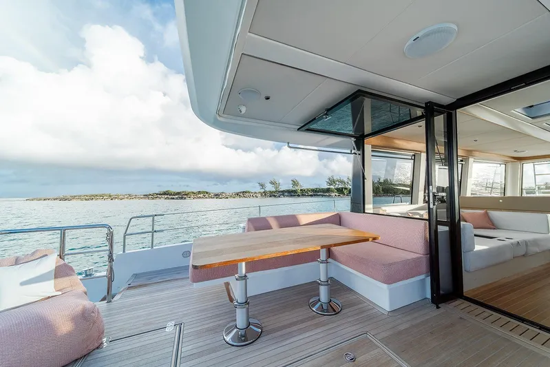  Yacht Photos Pics Luxurious Omikron Yachts OT-60, 2026 model, featuring elegant deck seating and ocean view.