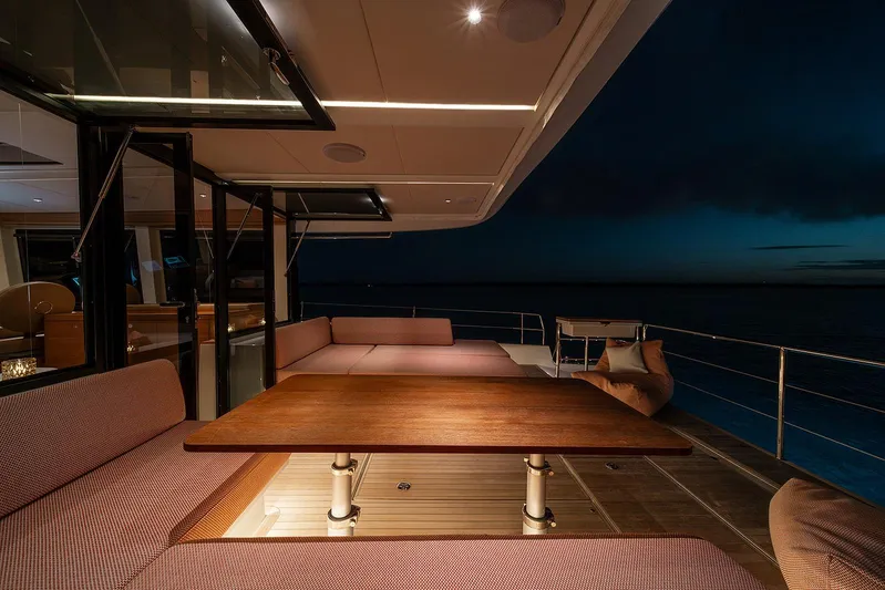  Yacht Photos Pics Luxurious Omikron Yachts OT-60 deck at night, featuring elegant seating and ambient lighting.