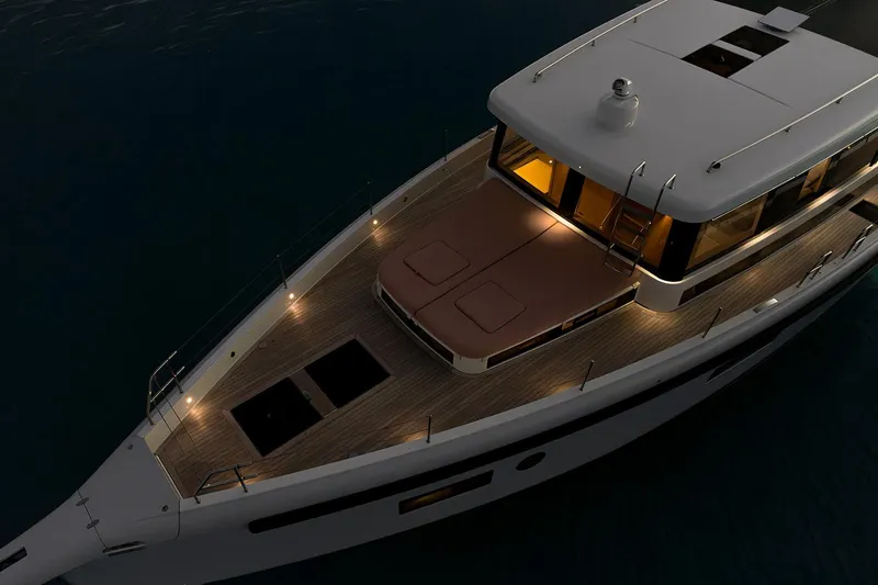 Yacht Photos Pics Luxurious 2026 Omikron Yachts OT-60 illuminated at night on calm waters.