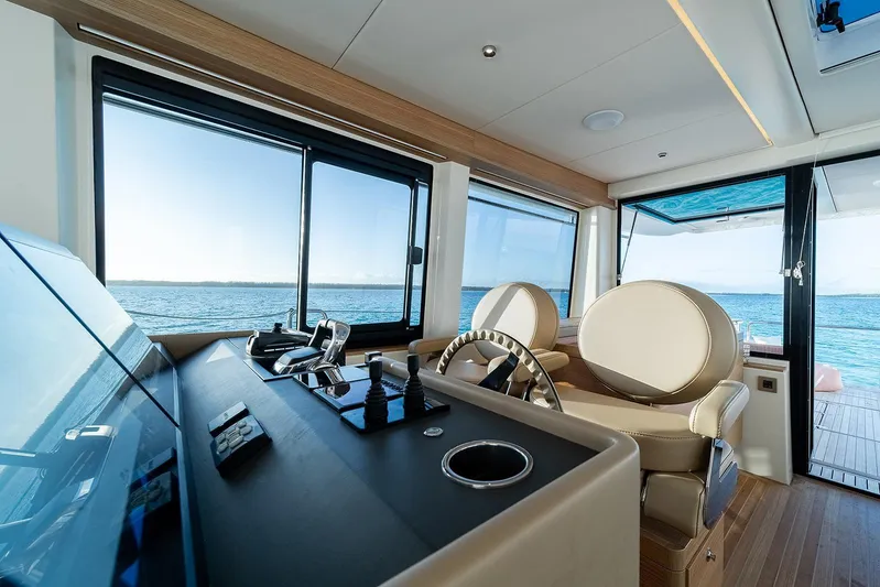  Yacht Photos Pics Luxurious interior of 2026 Omikron Yachts OT-60, featuring modern helm and ocean view.