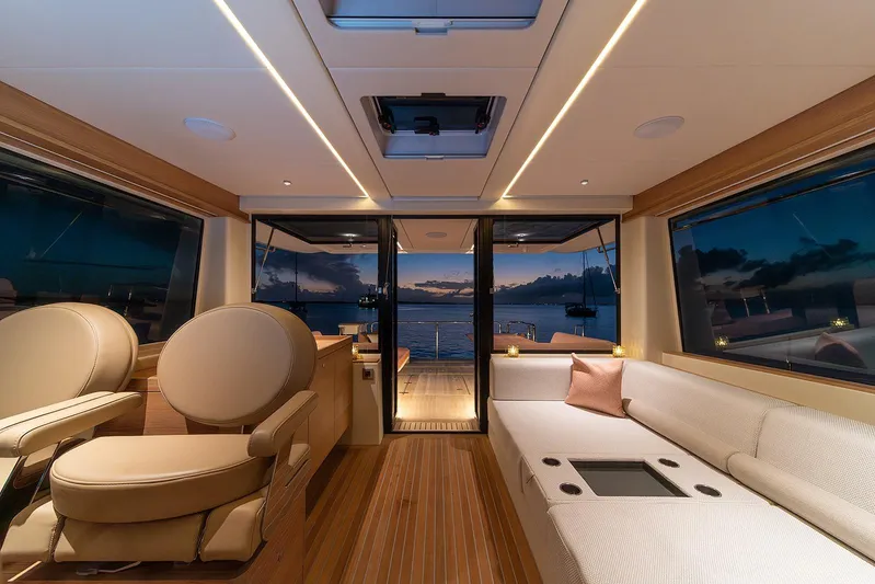  Yacht Photos Pics Luxurious interior of 2026 Omikron Yachts OT-60, featuring elegant seating and ambient lighting.