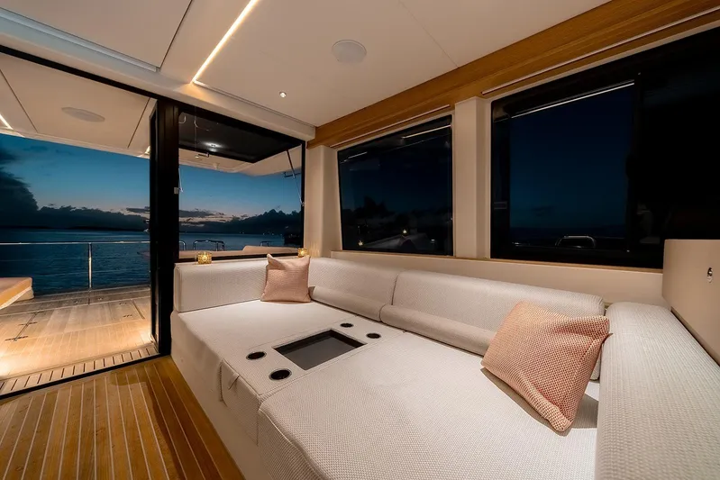  Yacht Photos Pics Luxurious interior of 2026 Omikron Yachts OT-60 with ocean view at sunset.