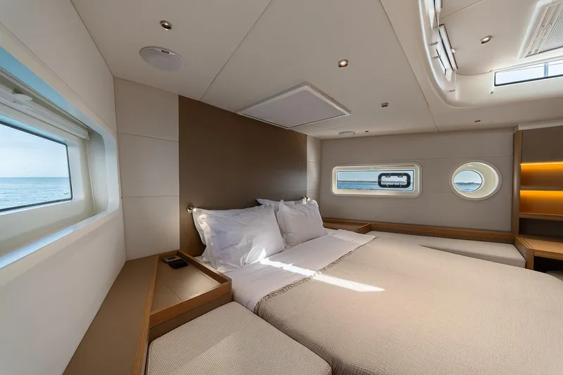 Yacht Photos Pics Luxurious bedroom interior of 2026 Omikron Yachts OT-60 with ocean view windows.