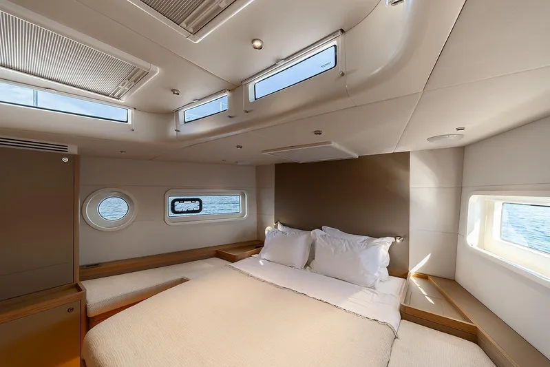  Yacht Photos Pics Luxurious bedroom interior of 2026 Omikron Yachts OT-60 with ocean view windows.