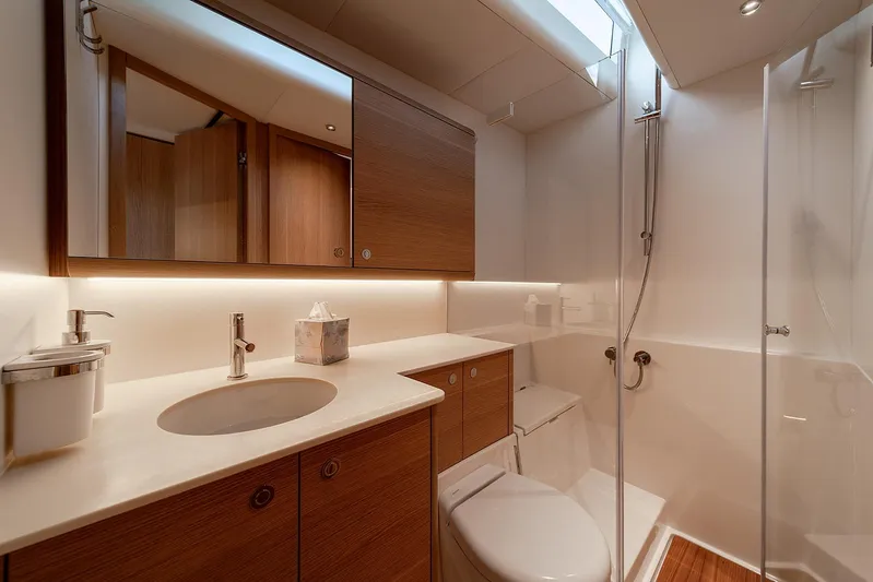  Yacht Photos Pics Luxurious bathroom in 2026 Omikron Yachts OT-60, featuring modern fixtures and elegant wood accents.