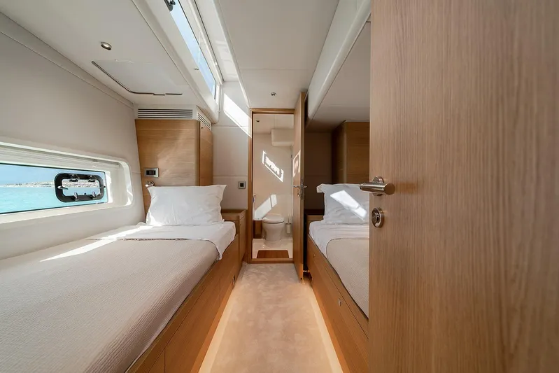  Yacht Photos Pics Luxurious twin cabin interior of 2026 Omikron Yachts OT-60, featuring modern design and natural light.