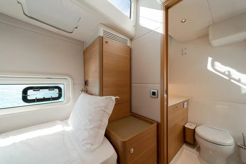  Yacht Photos Pics Luxurious cabin interior of 2026 Omikron Yachts OT-60 with modern bathroom.