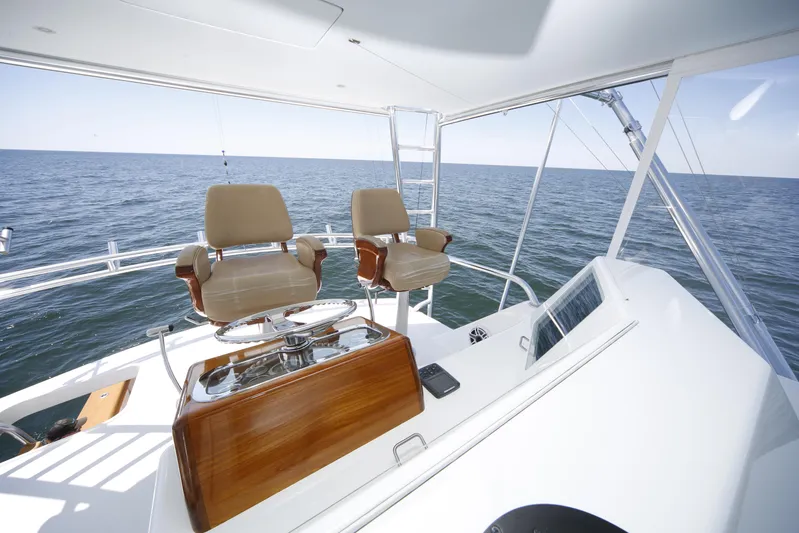 Pier Pressure Yacht Photos Pics Luxury yacht helm with dual seats, ocean view; Jim Smith 65 Convertible, 2000 model.