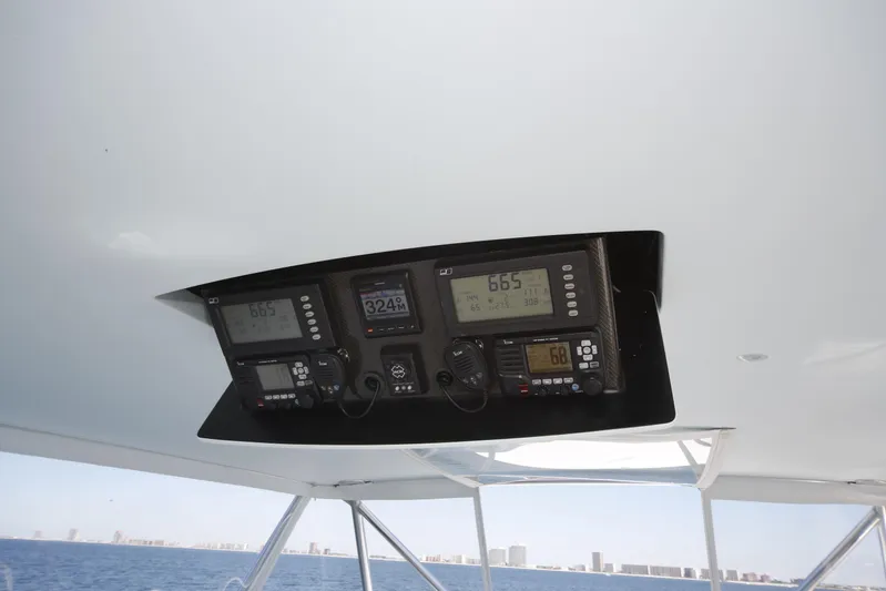 Pier Pressure Yacht Photos Pics Control panel of a 2000 Jim Smith 65 Convertible boat with ocean view.