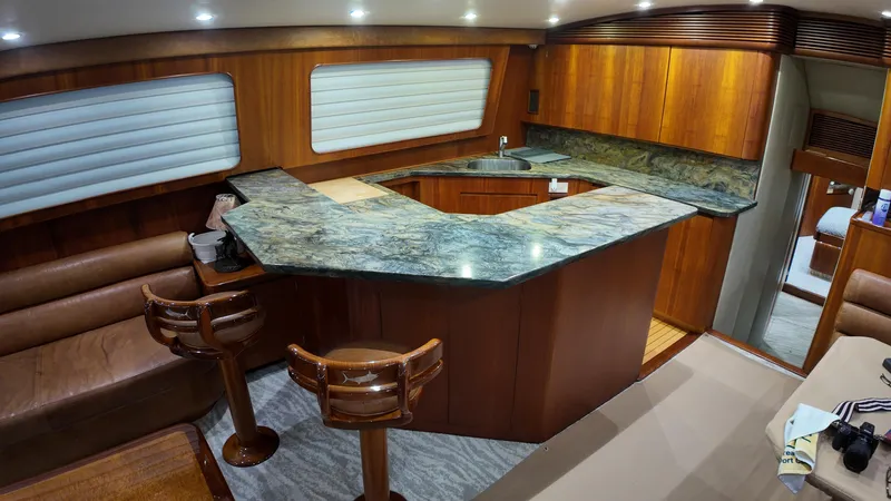 Pier Pressure Yacht Photos Pics Luxurious yacht interior with wooden cabinetry and marble countertops, Jim Smith 65 Convertible, 2000 model.