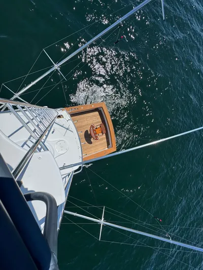 Pier Pressure Yacht Photos Pics Aerial view of Jim Smith 65 Convertible yacht on open water, 2000 model.