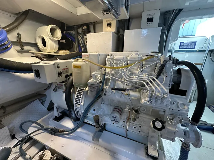 Pier Pressure Yacht Photos Pics Engine room of a 2000 Jim Smith 65 Convertible, showcasing detailed machinery and components.