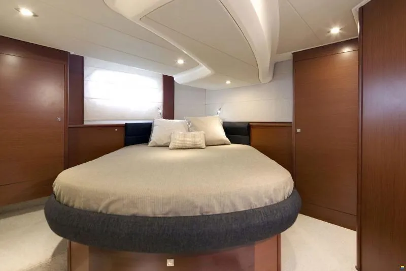  Yacht Photos Pics Luxurious cabin interior of 2012 Prestige 440 S yacht with elegant bedding and wood finishes.